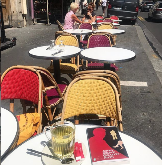 book on table paris cafe